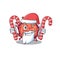 Friendly contagious corona virus in Santa Cartoon character having candies