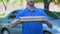 Friendly delivery man giving pizza box, food order online, restaurant service