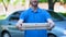 Friendly delivery man giving pizza box, food order online, restaurant service