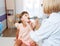 Friendly doctor pediatrician with patient child at clinic