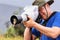 Friendly Galapagos flycatcher sitting on a lens hood, Santiago I