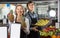 Friendly grocery staff at farm food store