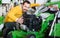 Friendly guy deciding on best lawnmower in garden equipment shop