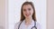 Friendly happy young female doctor physician smiling face closeup portrait