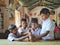 friendly kids in school uniform playing games with smily faces in a local village primary school