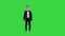 Friendly little boy in a suit says hi and then says bye on a Green Screen, Chroma Key.