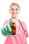 Friendly medical nurse lady smiling showing bottle of pills