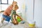 Friendly Mother and son painting house wall and having fun, Repair In Apartment Flat