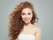 Friendly redhead girl portrait. Cheerful woman with long healthy curly hair