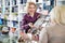 Friendly seller helps customers choose cosmetics