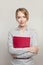 Friendly successful woman with documents standing against white background