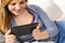 Friendly teenage girl reading on digital tablet