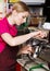 Friendly waitress making coffee