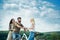 Friends on bicycle in the park. Group adventure with happy and smiling. Woman riding on bike on road along trail on