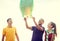 Friends with chinese sky lanterns on the beach