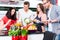 Friends cooking pasta and meat in domestic kitchen