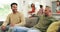 Friends, couch and men talking in a family home in conversation in a living room together at a gathering. Discussion