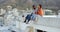 Friends, couple hanging out and sitting rooftop talking with view of cityscape on summer evening. Diversity, friendship