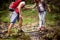 Friends Crossing River.Journey in the forest