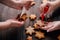 Friends decorating christmas gingerbread cookies