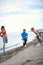 Friends doing stretching exercises on the beach