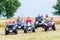 Friends driving off-road with quad bike