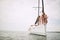 Friends enjoy the wind on a yacht