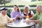 Friends Enjoying A Beverage By A Golf Course