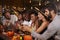 Friends enjoying a Halloween party at a bar making a toast