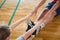 Friends exercising while sitting on hardwood floor