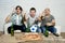 Friends fanatic football fans watching tv match with beer bottles and pizza suffering stress