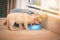 Friends forever...you eat, I eat. An adorable little girl sharing a bowl of food with her puppy at home.