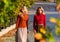 Friends girls. Autumn stylish outfit. Adorable ladies enjoy sunny autumn day. Fashionable clothes. Femininity and