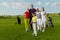 Friends golfers with kid happy to finish their golf game