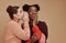 Friends, gossip and black woman laughing at secret on studio background and product placement mockup. Secrets, rumor and