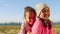 Friends, grass and portrait of girl children at beach having fun and playing in a park. Nature, freedom and sisters with