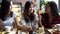 Friends group of Asian female enjoying and having a conversation at cafe and restaurant