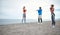 Friends having a training on the beach