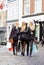 Friends for life. Rearview shot of a group of friends walking along a cobbled street with shopping bags.