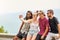 Friends make everything more fun. a group of friends posing for a selfie while relaxing together outside.