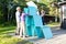 Friends Making Pyramid With Wooden Planks On Patio In Forest