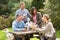 Friends Outdoors Enjoying Drink In Pub Garden