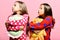 Friends in pink pajamas isolated on pink background