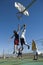 Friends Playing Basketball Against Blue Sky