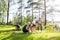 Friends Playing With Building Blocks On Grassy Field