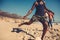 Friends playing football on the beach