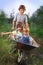 friends playing in the plane using a garden carts