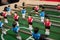 Friends Playing Table Soccer Game. table football or kicker with miniature players. game table. Games, entertainment