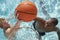 Friends Playing Water Basketball In Pool