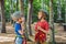 Friends on the ropes course. Young people in safety equipment are obstacles on the road rope